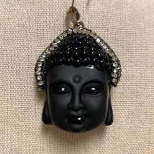 Beautiful pendant. Black and silver with some rhinestones.
